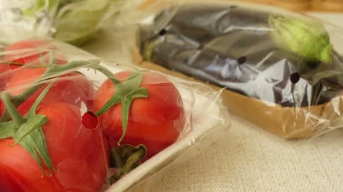 Fresh vegetables wrapped for delivery at local market Stock Footage 314354075