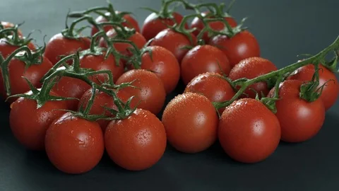 Fresh vegetables.Washed cherry tomato on a black table Stock Footage 87237518