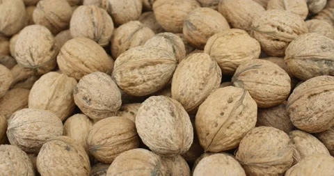 Fresh walnuts closeup rotating loopable Stock Footage 152445369