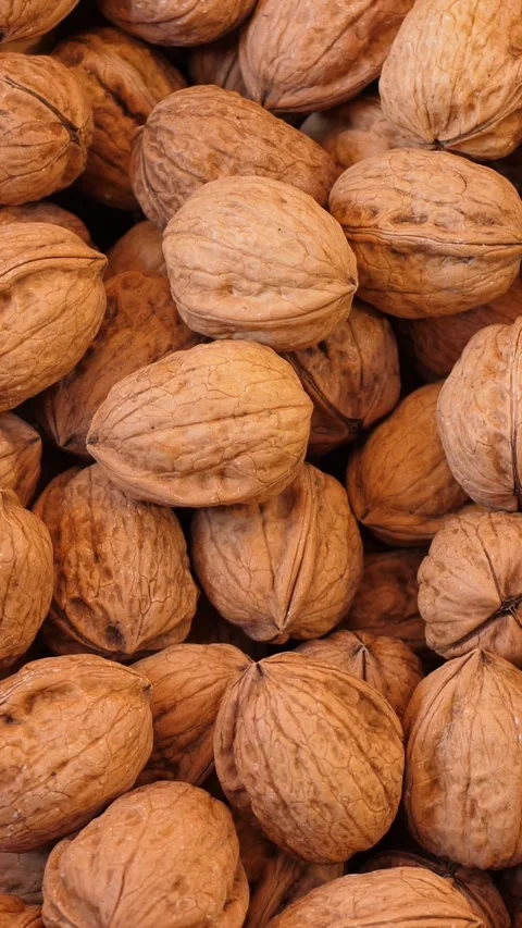 Fresh Walnuts Piled High at a Vibrant Italian Local Produce Market Stock Footage 335695182