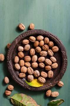 Fresh walnuts in rustic bowl Stock Photos