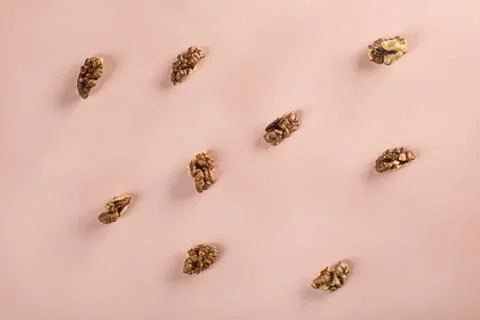Fresh walnuts slice pattern on colorful background Stock Photos