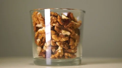 Fresh walnuts without shell in transparent glass with white reflection Stockbeeldmateriaal 75241570