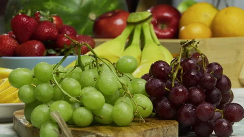 Fresh water droplets on various grapes and other fruit - medium shot Stock Footage 341209267