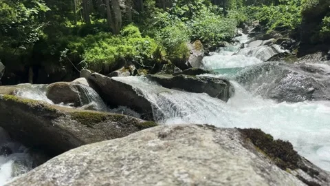 Fresh Water River Cascading Through Rocky Terrain in the Sunny Austrian Alp.. Stock Footage 338170518