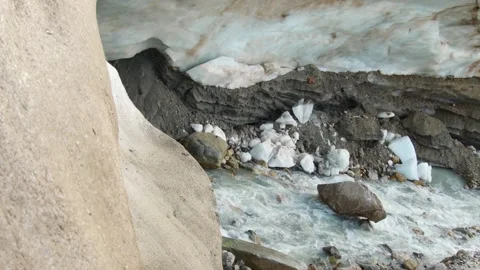 Fresh water river flows under Shkhara glacier blue ice cave in Svaneti, Geo.. Stock-Footage 333412397