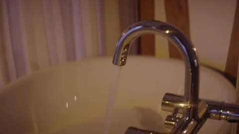 Fresh Water Running From Chrome Kitchen Faucet Into Sink, Close Up Shot Stock-Footage 341419524
