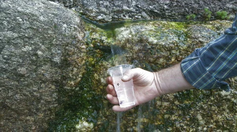 Fresh water source flowing among stones Stock Footage 457575