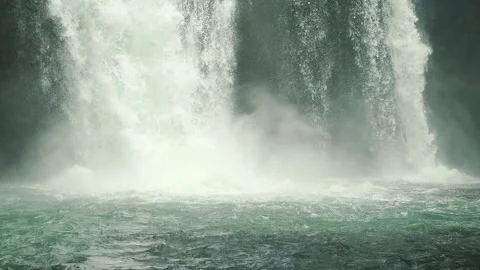 Fresh water splashes under the waterfall close up  Video stock 163951290