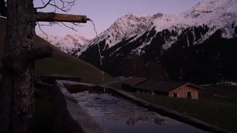 Fresh water spring flowing in the alps at dusk 스톡 동영상 306853566