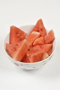 Fresh watermelon chunks in a patterned white bowl Stock Photos