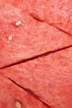 Fresh watermelon triangular slices as background or texture for summer fruits Stock Photos