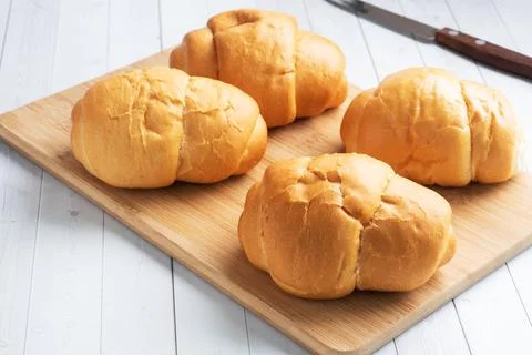 Fresh wheat bread rolls. Rolls for a hot dog or hamburger. White background.. Stock Photos