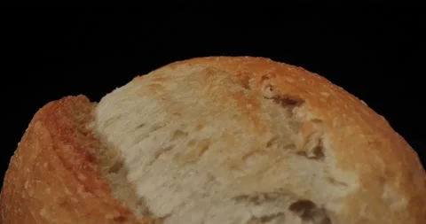 Fresh white bread buns close up. Black background. Stock Footage 234544570