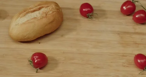 Fresh white bread buns close up with cherry tomatos Stock Footage 236321660