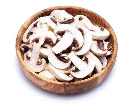 Fresh white champignon mushrooms in wooden bowl isolated on white background Stock Photos