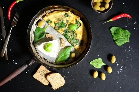 Fresh white cheese with scrambled eggs and spinach Stock Photos