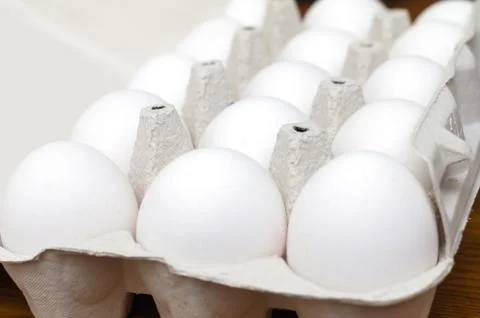 Fresh white eggs in box. Close up. Stock Photos