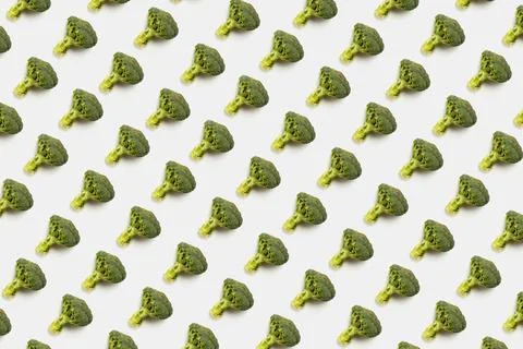 Fresh whole broccoli pattern isolated on white background. Flat lay, top view Stock Photos