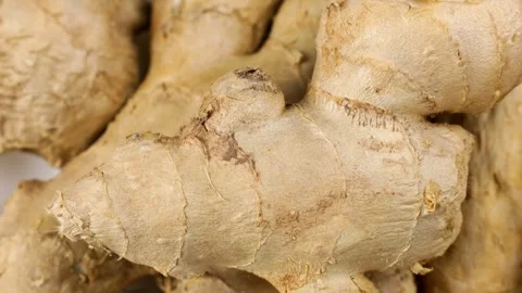 Fresh whole ginger root pieces circle rotation close up Stock Footage 274907741
