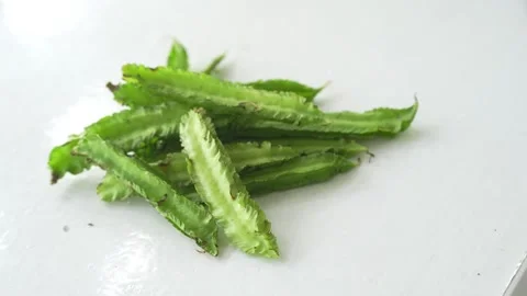 Fresh winged beans placed on a clean white Stock Footage 337976319