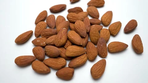Fresh wood nuts rotating moving view in white background Stock Footage 282848293