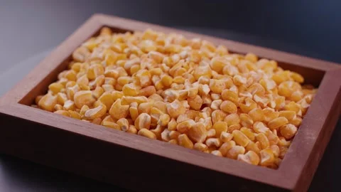 Fresh Yellow Corn Kernels Filling Wooden Bowl, Close-up Food Shot 動画素材 336560374