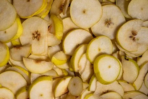 Fresh yellow pear slices closeup texture pattern food background Stock Photos