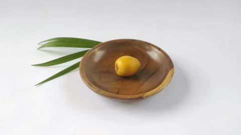 A Fresh Young Dates or Rutob Dates on A Wooden Plate Stock Footage 304792087