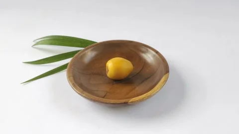 A Fresh Young Dates or Rutob Dates on A Wooden Plate Stock Footage 304792089