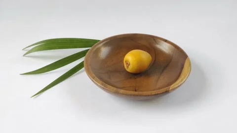 A Fresh Young Dates or Rutob Dates on A Wooden Plate Stock Footage 304792165