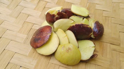 Fresh Young Raw Jengkol Beans Arranged on Woven Bamboo Mat Video stock 342395651