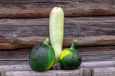 Fresh zucchini on wooden background Stock Photos