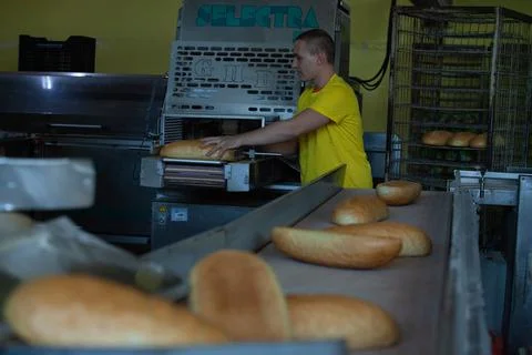 Freshly backed bread ready to be packed Stock Photos