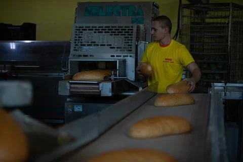 Freshly backed bread ready to be packed Stock Photos