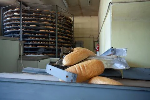 Freshly backed bread ready to be packed Stock Photos