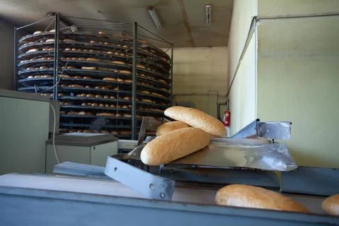 Freshly backed bread ready to be packed Stock Photos