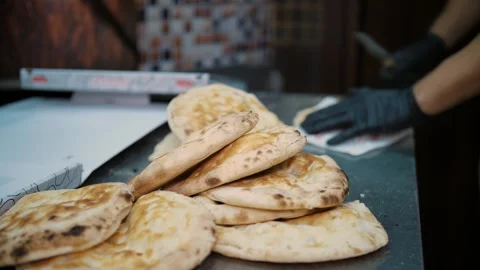 Freshly baked Arabic bread for delicious kebab. Custom-made flatbreads in the Stock Footage 264581935