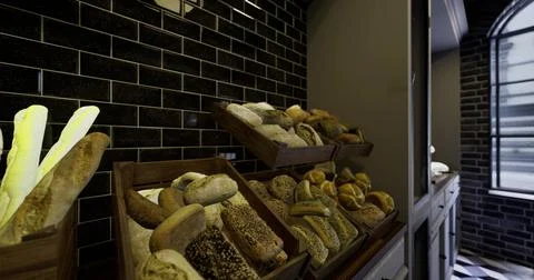 Freshly baked artisan bread displayed in a cozy bakery setting Stock Illustration