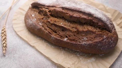 Freshly baked artisan rye bread loaf Stock Footage 336257958