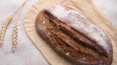 Freshly baked artisan rye bread loaf Stock Footage 336307927