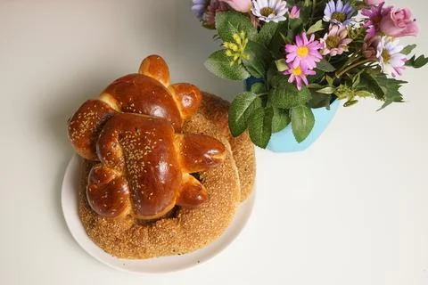 Freshly baked assorted rolls with a stuffing in a white plate on the table. Stock Photos