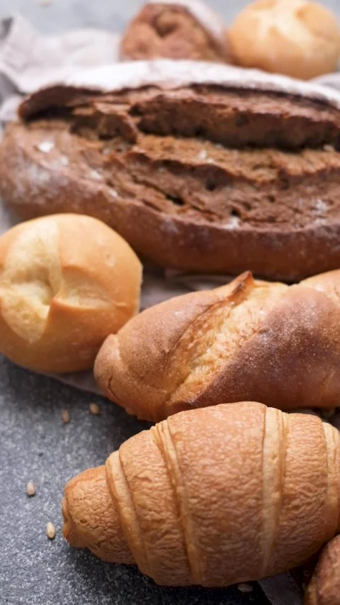 Freshly baked bread assortment and wheat ears Stock Footage 336307911