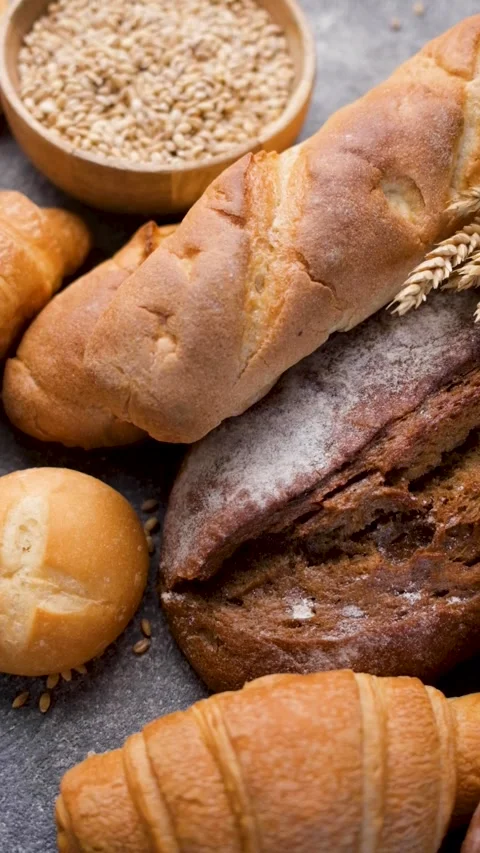 Freshly baked bread assortment and wheat ears Stock Footage 336619789