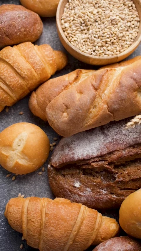 Freshly baked bread assortment and wheat ears Stock Footage 336677011