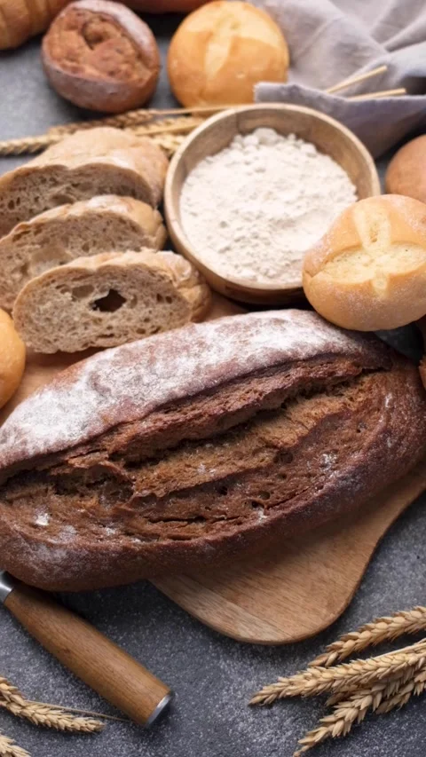 Freshly baked bread assortment with flour and wheat Stock Footage 336307958