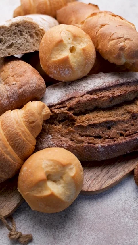 Freshly baked bread assortment top view Stockbeeldmateriaal 334396136