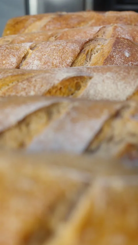 Freshly Baked Bread on Bakery Rack Slow Motion Stock Footage 345878676