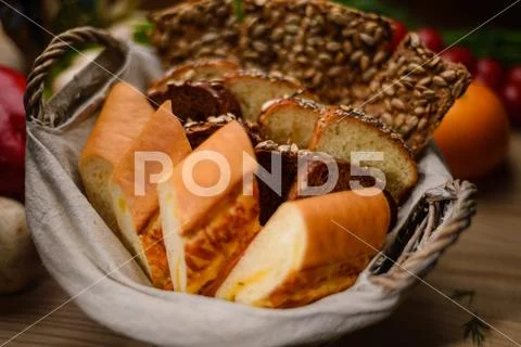 Freshly baked bread in a basket Stock Photos