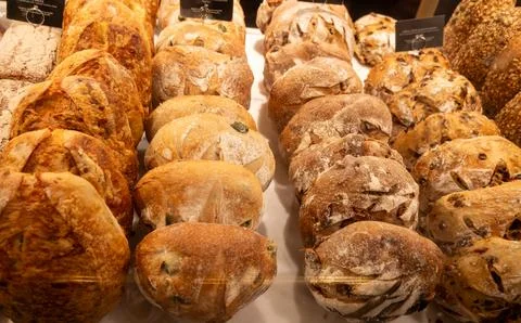 Freshly baked bread buns with crispy golden crust from sourdough, authentic.. Stockfoto's